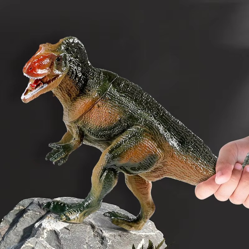 Dinosaur toy set with realistic dino figures inside a plastic storage box with handle and colorful Jurassic-themed label
