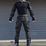 Full tactical camouflage clothing set with shirt, pants, gloves, cap, and protective pads for airsoft, hunting, and outdoor sports
